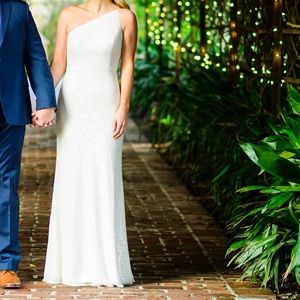 Worn once for an engagement party. Original had train but got it hemmed off.